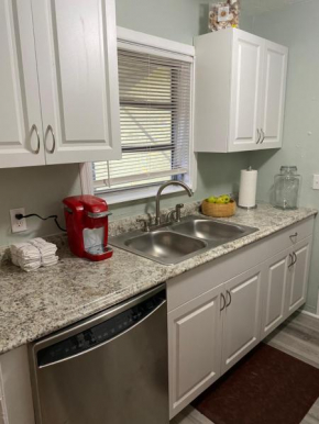Perfect for large groups! 3 Bedroom House plus Cottage, Centrally located to Beach and Shopping, Lots of Parking Private Backyard with 2 Patios, Grill, Firepit!